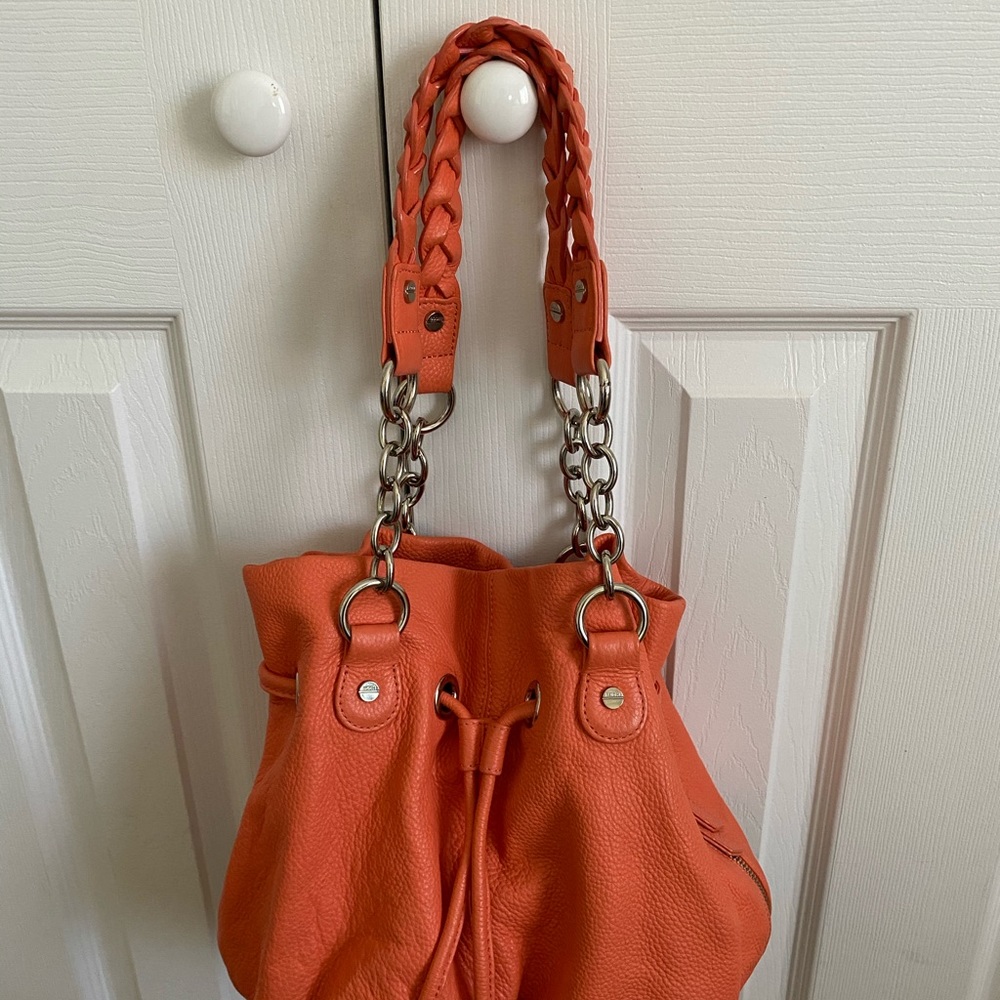 Leather handbag orange color.